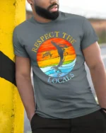 Respect the Locals T-Shirt Ocean Wildlife Sunset - model in grey shirt leaning against column