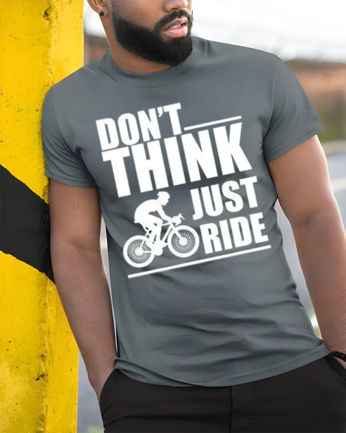 Don’t Think Just Ride Cycling T-Shirt Biker Motivation - model in grey shirt leaning against column