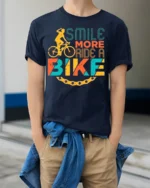 Smile More Ride A Bike Colorful Cyclist Graphic T-Shirt - model wearing navy shirt, hands in pockets