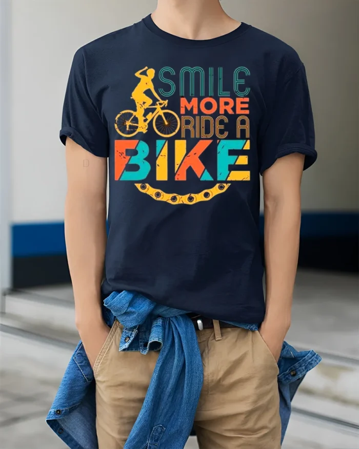 Smile More Ride A Bike Colorful Cyclist Graphic T-Shirt - model wearing navy shirt, hands in pockets