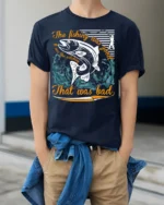 Funny Fishing T-Shirt The Fishing Was Good Catching Bad - model wearing navy shirt, hands in pockets