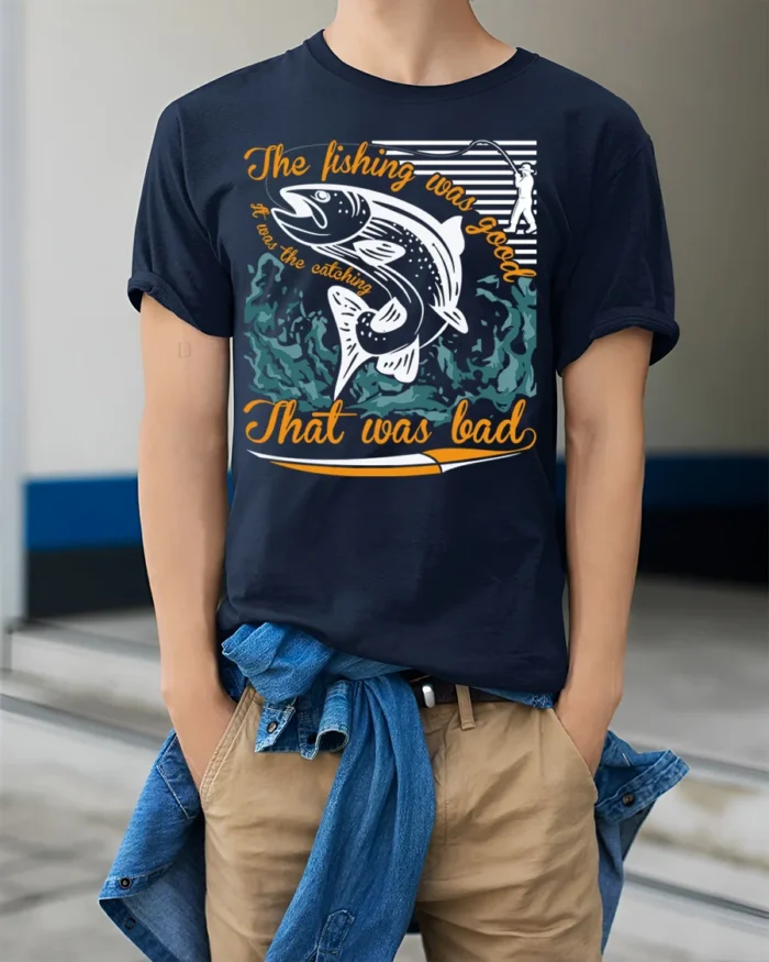 Funny Fishing T-Shirt The Fishing Was Good Catching Bad - model wearing navy shirt, hands in pockets
