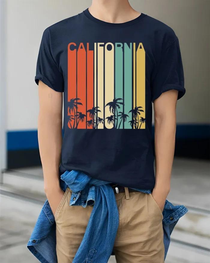 Retro California T-Shirt Vintage Sunset Palm Tree - model wearing navy shirt, hands in pockets