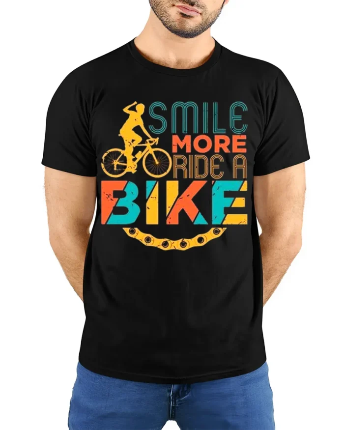 Smile More Ride A Bike Colorful Cyclist Graphic T-Shirt - model wearing black shirt, hands behind back