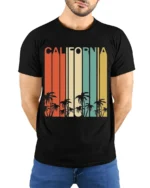 Retro California T-Shirt Vintage Sunset Palm Tree - model wearing black shirt, hands behind back