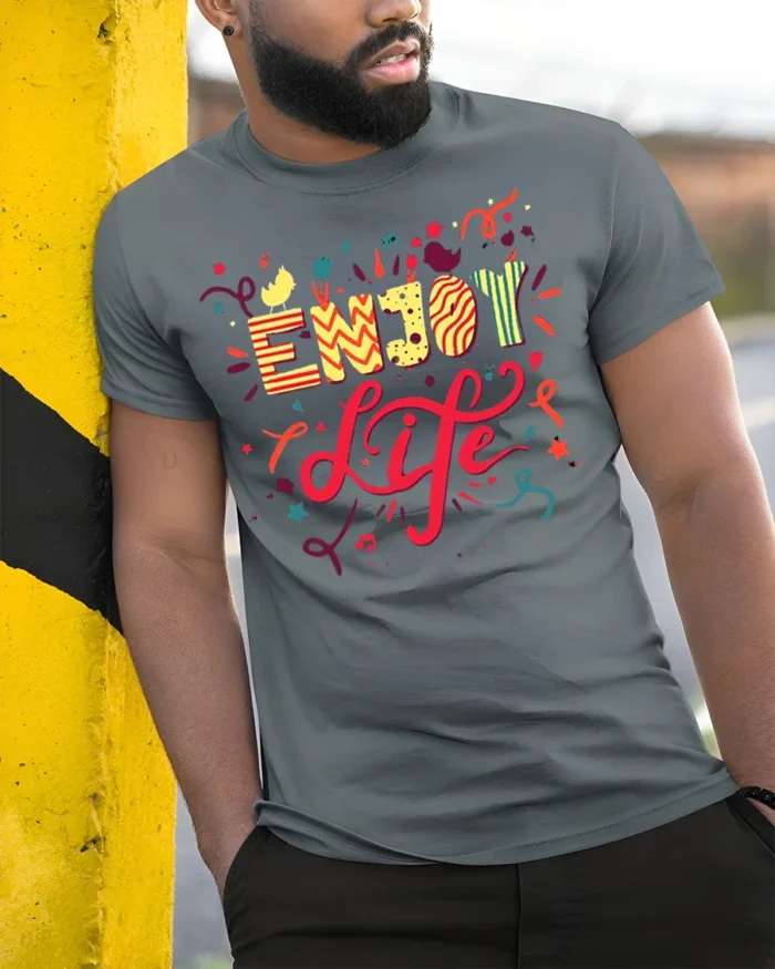 Enjoy Life Graphic T-Shirt Colorful Fun Positive Tee - model in grey shirt leaning against column