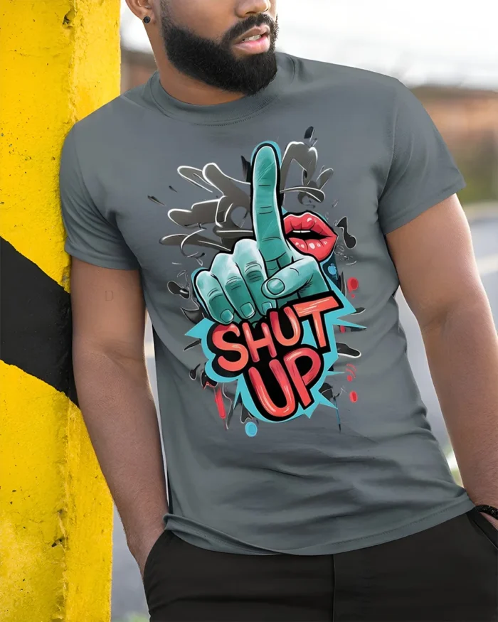 Shut Up Graffiti Style Bold Graphic Statement T-Shirt - model in grey shirt leaning against column