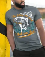 Funny Fishing T-Shirt The Fishing Was Good Catching Bad - model in grey shirt leaning against column