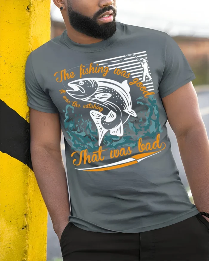 Funny Fishing T-Shirt The Fishing Was Good Catching Bad - model in grey shirt leaning against column