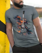 Flaming Guitarist T-Shirt Electric Fire Music Graphic - model in grey shirt leaning against column