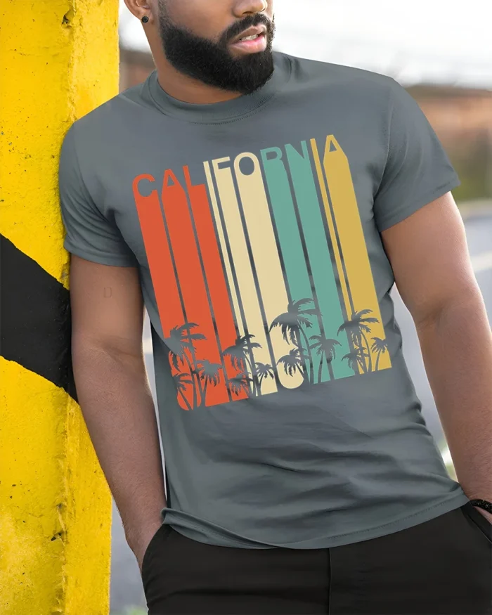 Retro California T-Shirt Vintage Sunset Palm Tree - model in grey shirt leaning against column
