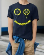 Smiley Bike Face T-Shirt Funny Cycling Chain Graphic - model wearing navy shirt, hands in pockets