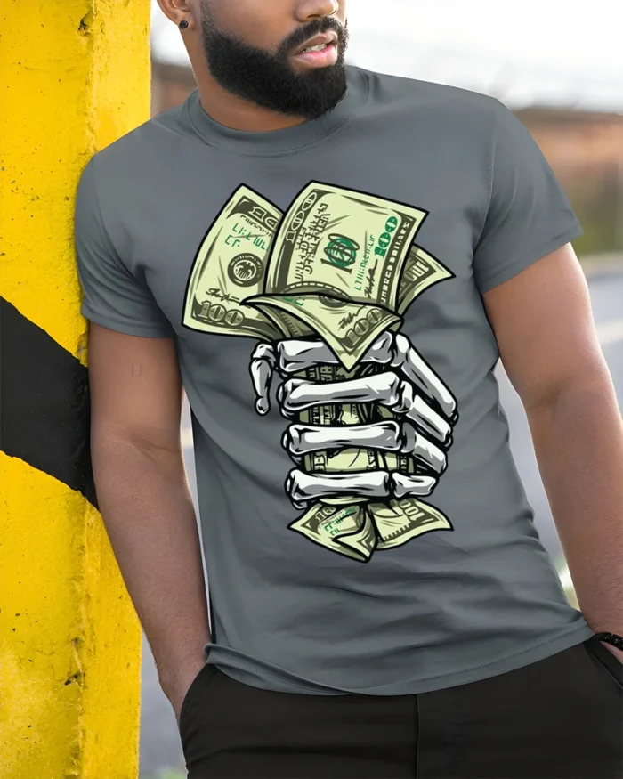 Skeleton Hand Money T-Shirt Street Hustle Graphic Tee - model in grey shirt leaning against column