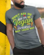 Funny Vegan T-Shirt Don’t Ask Me Why I’m Vegan Quote - model in grey shirt leaning against column