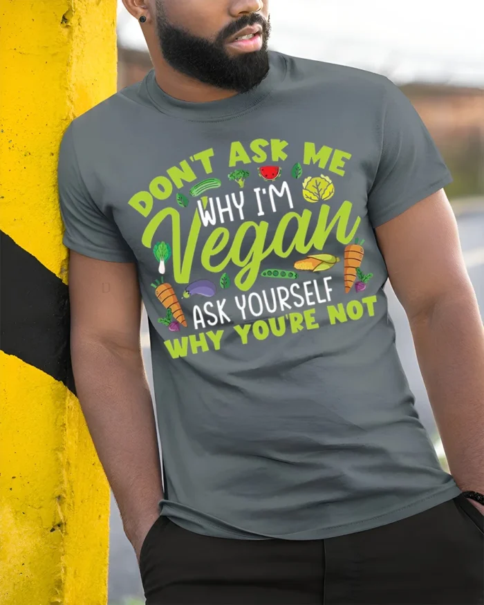 Funny Vegan T-Shirt Don’t Ask Me Why I’m Vegan Quote - model in grey shirt leaning against column