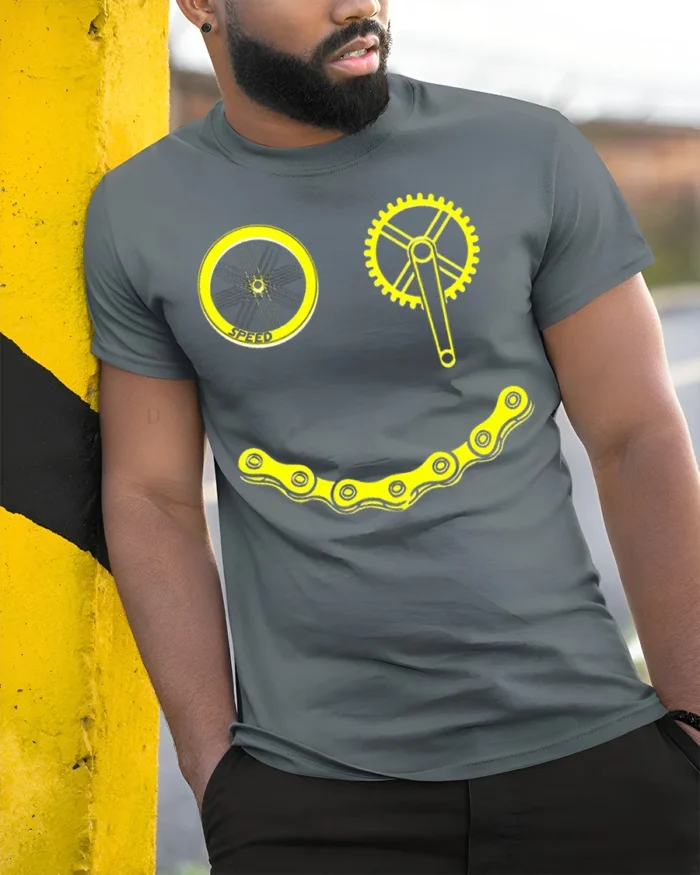 Smiley Bike Face T-Shirt Funny Cycling Chain Graphic - model in grey shirt leaning against column