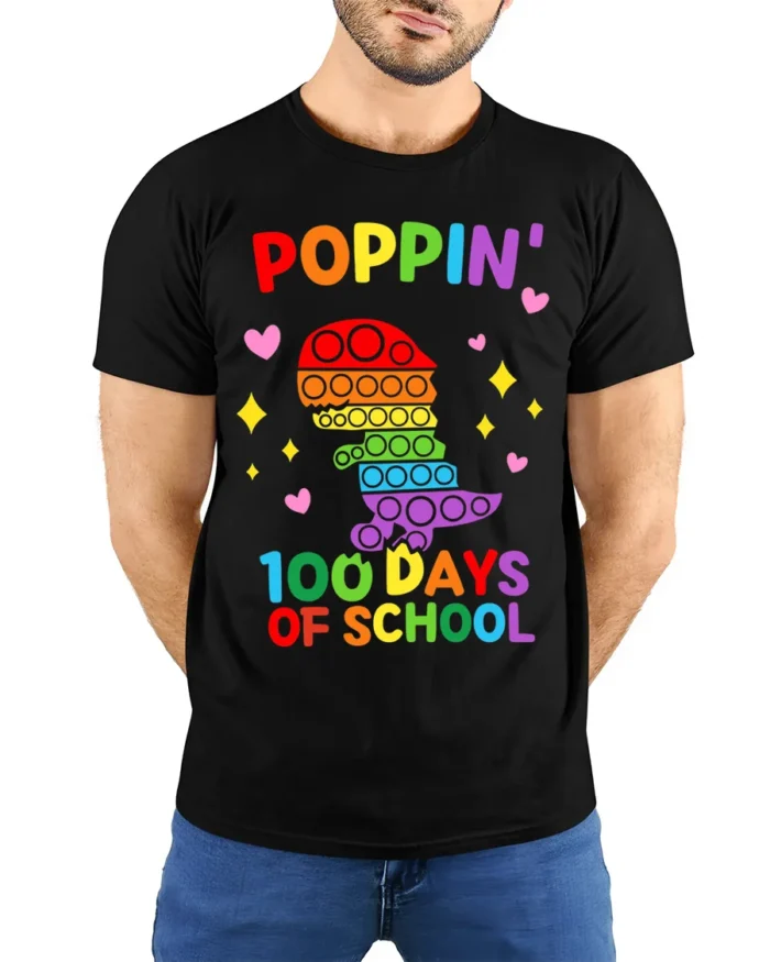 Colorful Dino Pop It 100 Days School T-Shirt - model wearing black shirt, hands behind back