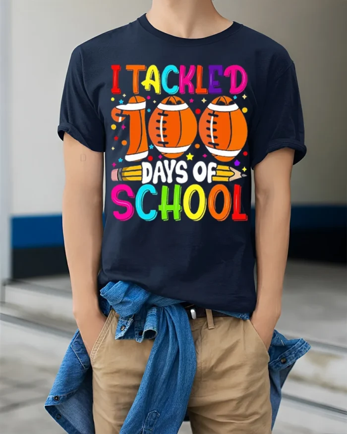 I Tackled 100 Days of School Football T-Shirt - model wearing navy shirt, hands in pockets