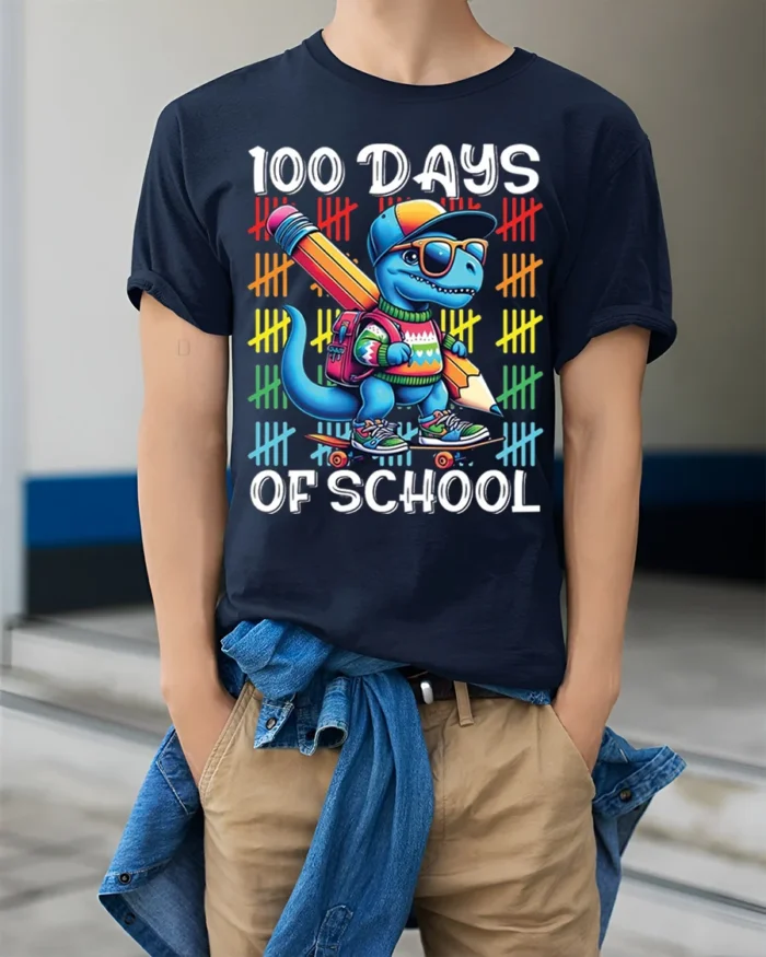 100 Days of School Dinosaur Skateboard T-shirt - model wearing navy shirt, hands in pockets