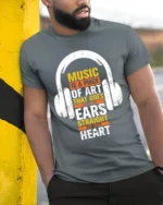 Music Is Art That Hits the Heart T-Shirt for Music Fans - model in grey shirt leaning against column