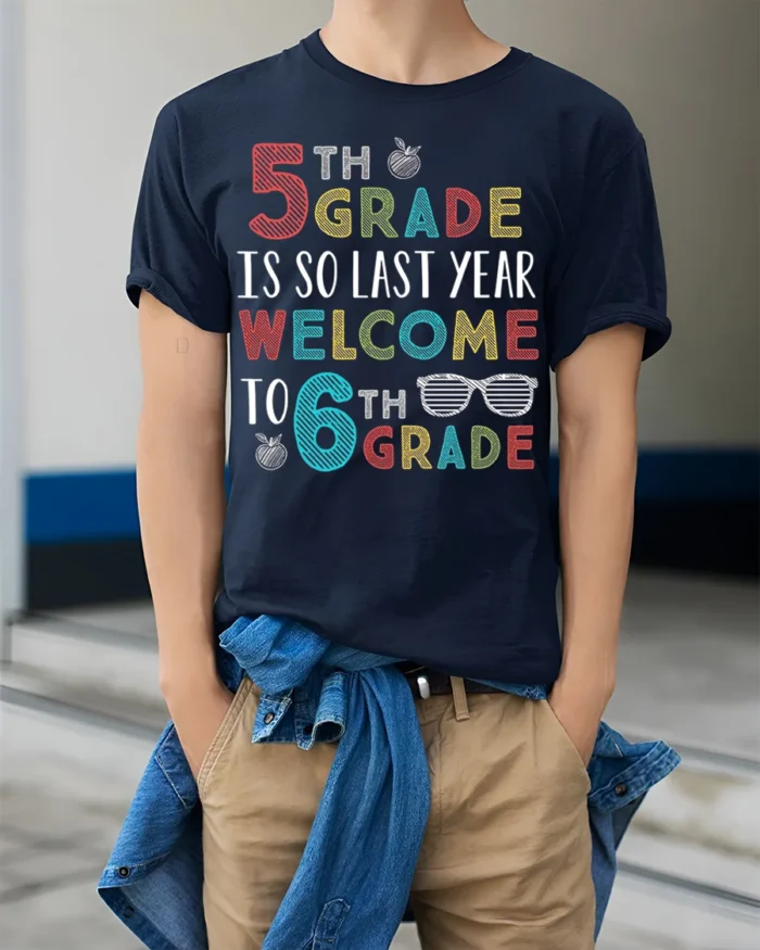 Funny 6th Grade Welcome Back to School T-Shirt - model wearing navy shirt, hands in pockets