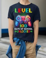 Level 100 Days of School Unlocked Gamer T-Shirt - model wearing navy shirt, hands in pockets