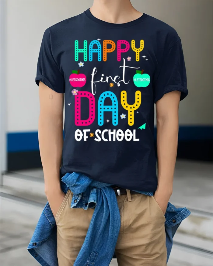 Happy First Day of School Colorful Teacher T-Shirt - model wearing navy shirt, hands in pockets