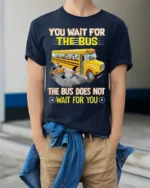 Funny School Bus T-Shirt You Wait for the Bus Tee - model wearing navy shirt, hands in pockets
