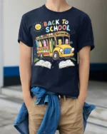 Cute Back to School T-Shirt with Bus and Pencils - model wearing navy shirt, hands in pockets