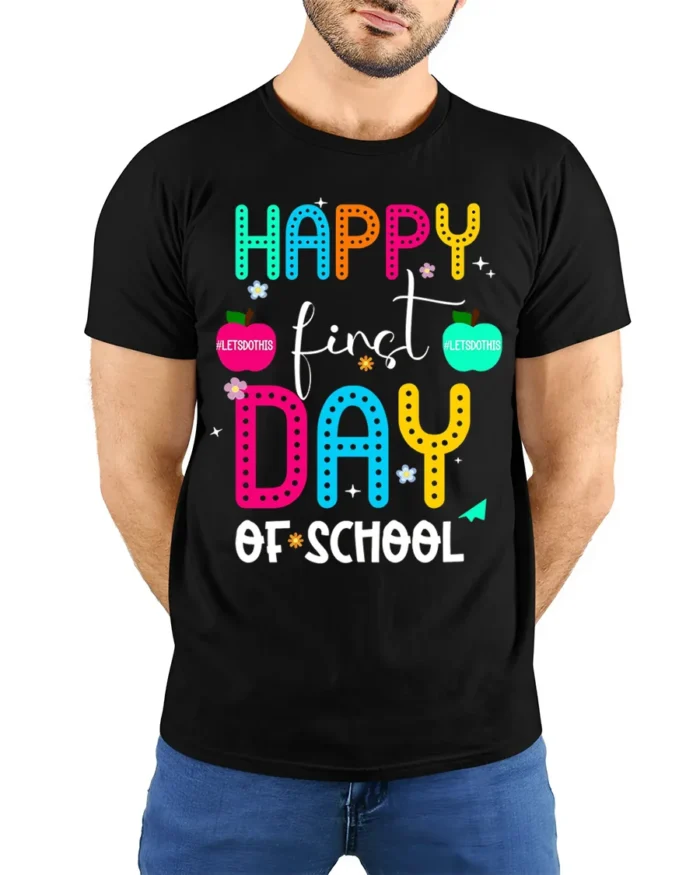 Happy First Day of School Colorful Teacher T-Shirt - model wearing black shirt, hands behind back