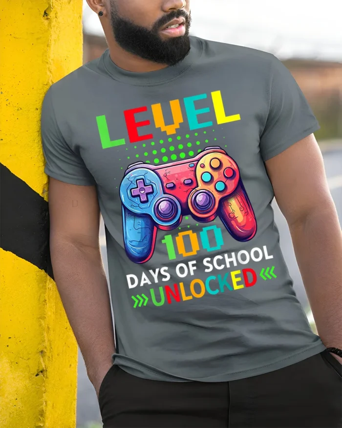 Level 100 Days of School Unlocked Gamer T-Shirt - model in grey shirt leaning against column
