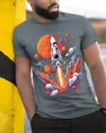 Retro Rocket Launch Space Planets Graphic T-Shirt - model in grey shirt leaning against column