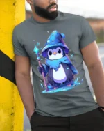 Wizard Penguin Magic Ice Staff Cute T-Shirt - model in grey shirt leaning against column