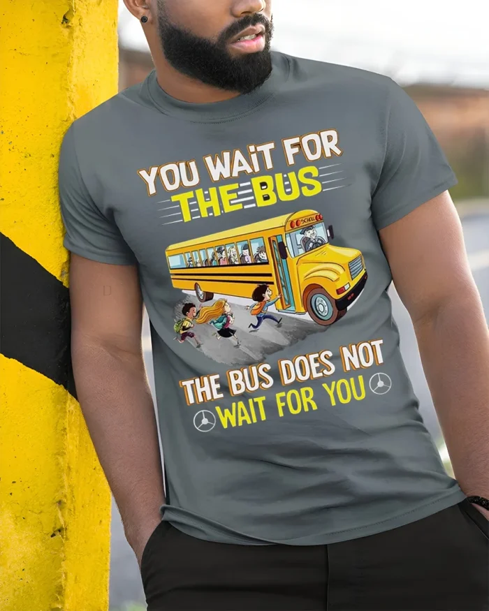 Funny School Bus T-Shirt You Wait for the Bus Tee - model in grey shirt leaning against column