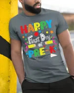 Happy First Day of Pre-K T-Shirt Colorful Tee - model in grey shirt leaning against column