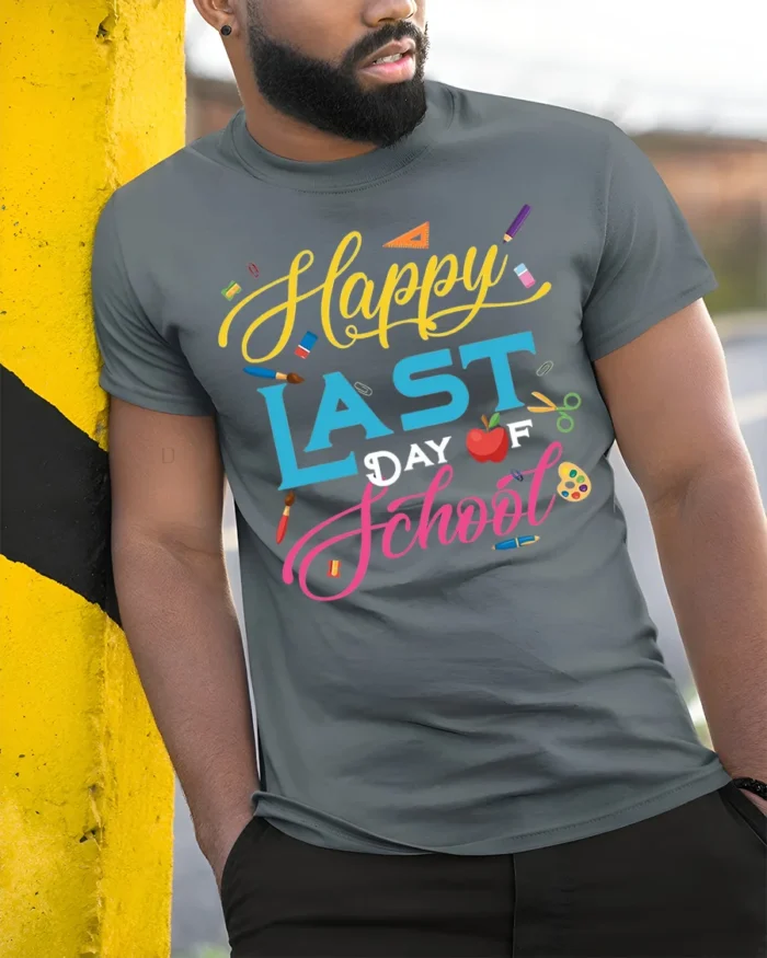 Happy Last Day of School T-Shirt Colorful Design - model in grey shirt leaning against column