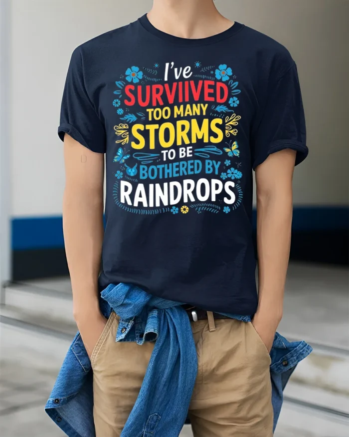 Survived Storms Raindrops Motivational Quote T-Shirt - model wearing navy shirt, hands in pockets