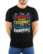 Survived Storms Raindrops Motivational Quote T-Shirt - model wearing black shirt, hands behind back
