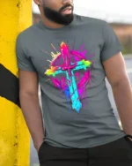 Neon Christian Cross T-Shirt Vibrant Faith Graphic - model in grey shirt leaning against column