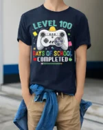 Level 100 Days of School Completed T-Shirt - model wearing navy shirt, hands in pockets