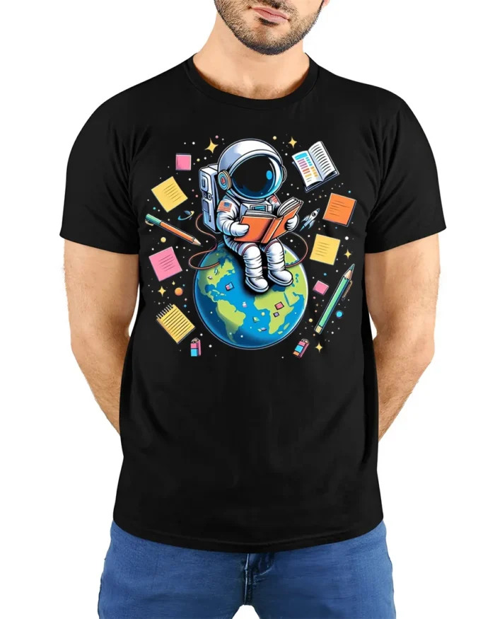 Astronaut Reading on Earth T-Shirt - model wearing black shirt, hands behind back