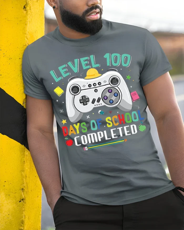 Level 100 Days of School Completed T-Shirt - model in grey shirt leaning against column