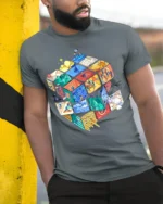 Colorful Puzzle Cube Art T-Shirt - model in grey shirt leaning against column