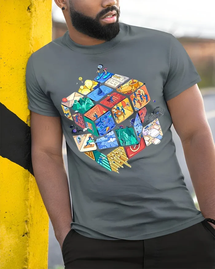 Colorful Puzzle Cube Art T-Shirt - model in grey shirt leaning against column