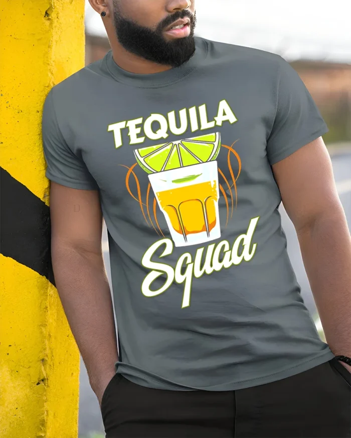 Tequila Squad Drinking Party T-Shirt for Summer Fun - model in grey shirt leaning against column