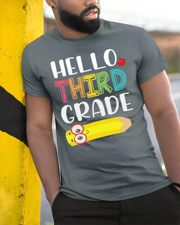 Hello Third Grade T-Shirt Cute Back to School Tee - model in grey shirt leaning against column