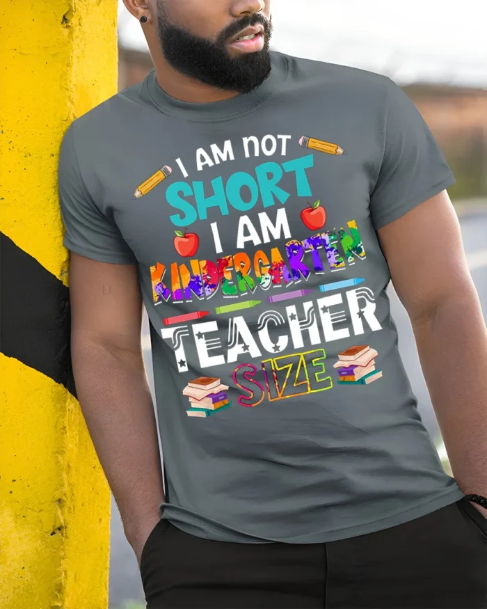 Funny Kindergarten Teacher Size T-Shirt - model in grey shirt leaning against column