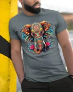 Colorful Elephant Floral Art T-Shirt - model in grey shirt leaning against column