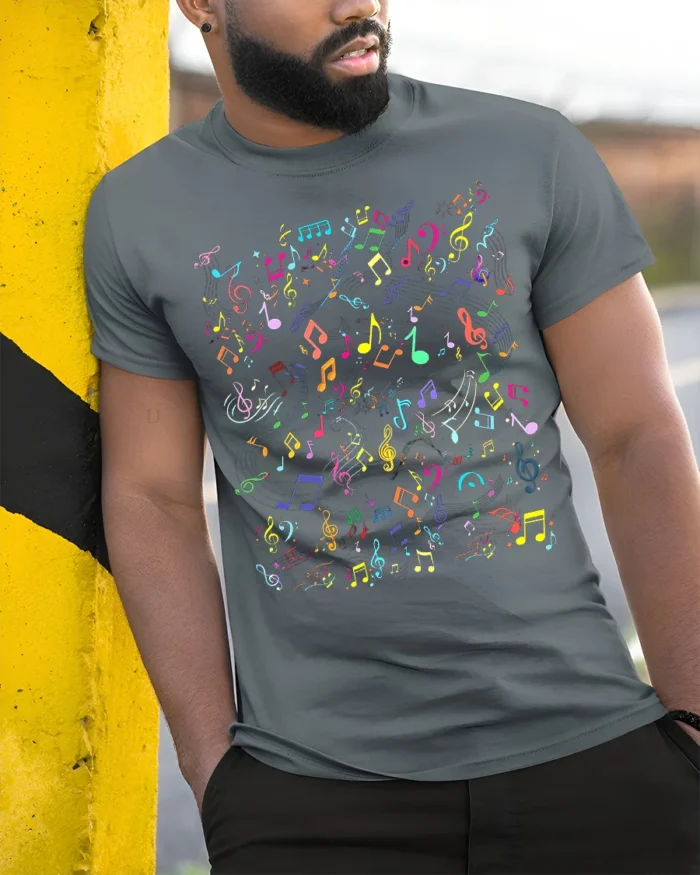 Colorful Music Notes Pattern Graphic T-Shirt - model in grey shirt leaning against column