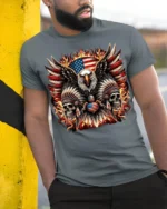 Patriotic Eagle Skull Fire Feathers T-Shirt - model in grey shirt leaning against column